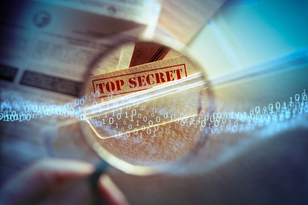 magnifying_lens_examines_top_secret_confidential_trade_secrets_by_dny59_gettyimages-185124853_abstract_binary_by_traffic_analyzer_gettyimages-1176400518_2400x1600-100851059-large.jpg